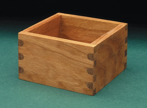 Box with rounded finger joints on one face and square finger joints on adjacent face.