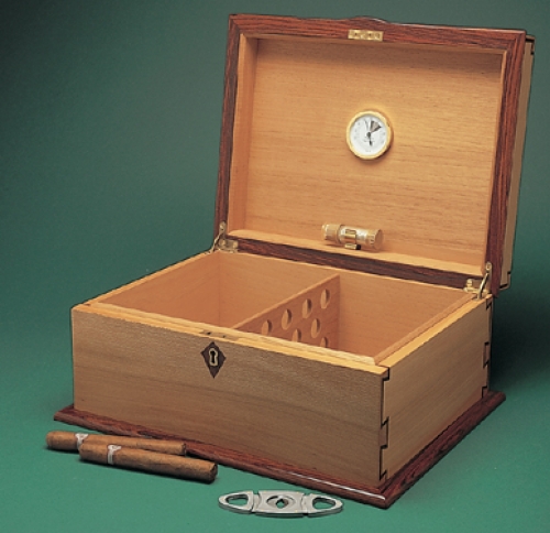 Inside of Cigar Humidor in english sycamore, madrone burl, cocobolo accents and spanish cedar lining, with inlaid half-blind dovetails. 6H x 14W x 11D